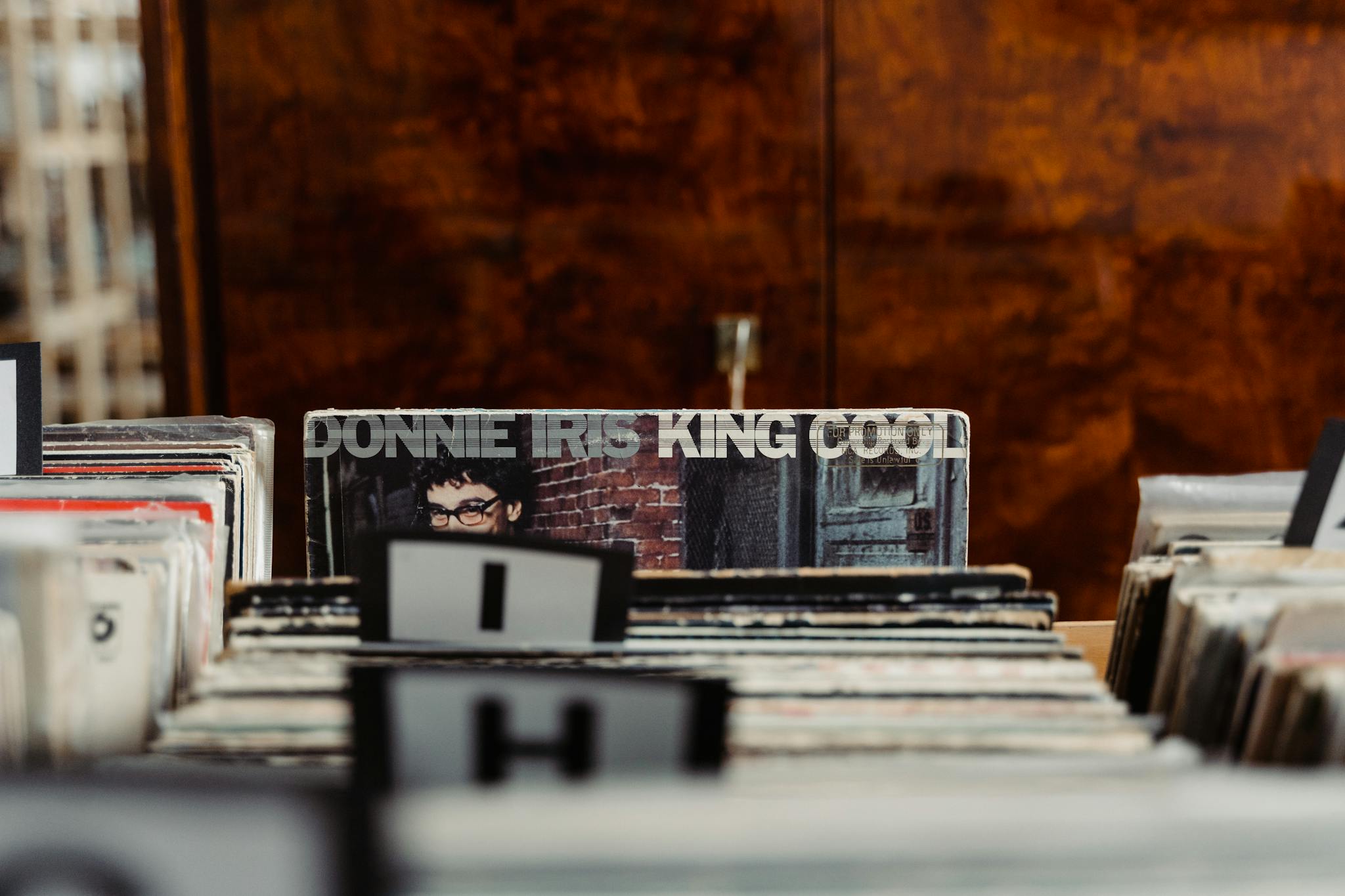 Explore a classic vinyl record collection in a vintage music store setting.