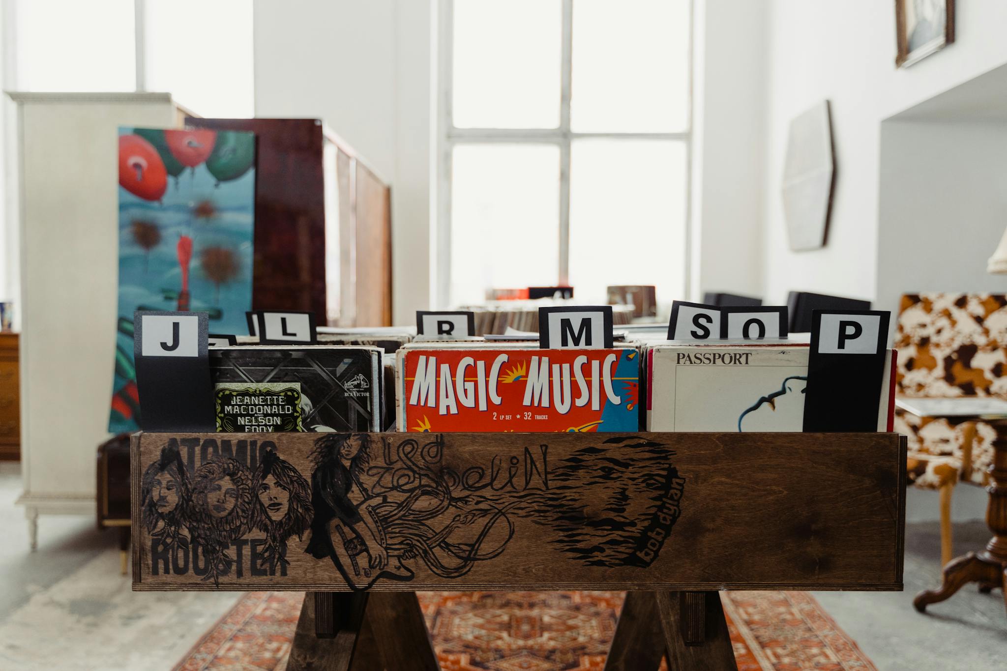 Explore a variety of vintage vinyl records in a chic, retro-themed indoor setting.